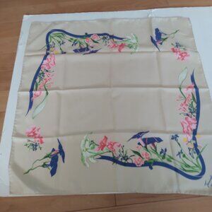 Multi color floral scarf marked Trimingham's Bermuda. Measures approx. 27"x27".
